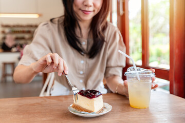 Young Asian woman enjoy eating dessert and drinks in cafe, Modern lifestyle