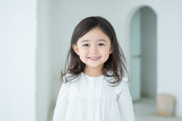 joyful child smiling in bright minimalist interior