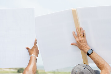 Holding up Protest Signs