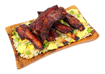 Mini Chinese barbecue mini pork ribs with egg fried rice in a olive wood serving dish isolated on a white background