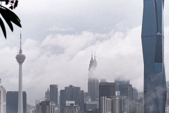 Iconic skyline in Kuala Lumpur with low drifting clouds