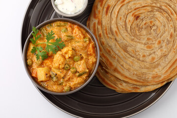 Malabar parotta with Kurma is a delicacy from the state of Kerala, Tamilnadu. Kurma is mixed veg south Indian curry with coconut milk