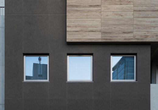 Fototapeta Modern Building Facade with Reflective Windows