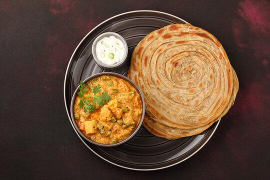 Malabar parotta with Kurma is a delicacy from the state of Kerala, Tamilnadu. Kurma is mixed veg south Indian curry with coconut milk