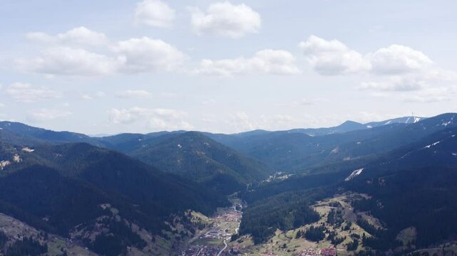 Aerial footage establishing small town in the mountains