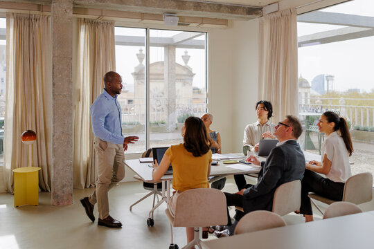 Diverse business team engaging in collaborative meeting in office