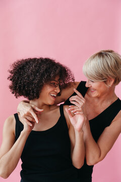Joyful Embrace of Two Women