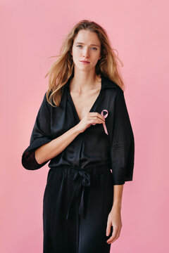 Empowerment Through Strength in Soft Pink Hues