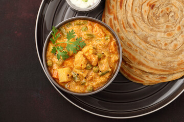 Malabar parotta with Kurma is a delicacy from the state of Kerala, Tamilnadu. Kurma is mixed veg south Indian curry with coconut milk