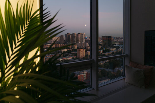 Stunning Urban Skyline at Dusk With Moonlight Glow