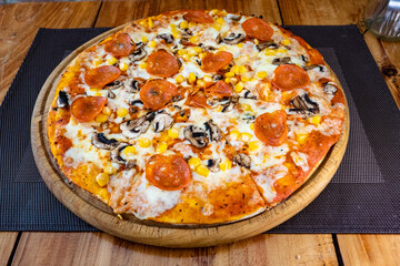 pizza mozzarella pepperoni mushroom and corn