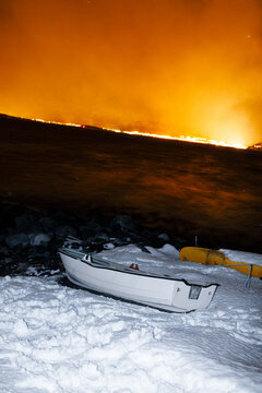 Frozen boat, fiery sky