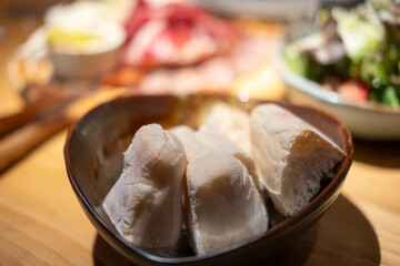 Sliced bread served in a bowl as ac accompaniment to meals in the restaurant