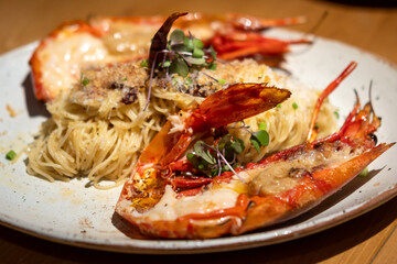 Spaghetti with grilled river prawn served on plate