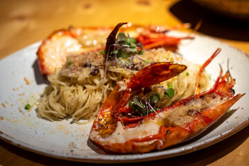 Spaghetti with grilled river prawn served on plate
