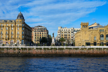 View across river of park and colorful buildings of San Sebastián