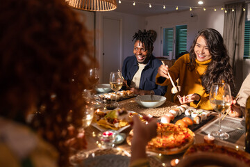 Friends enjoying a festive dinner gathering at home