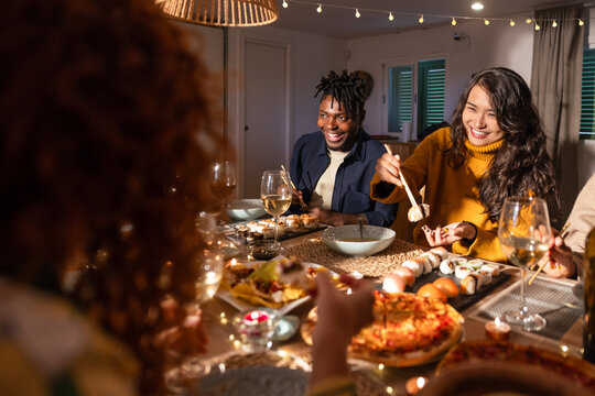 Friends enjoying a festive dinner gathering at home