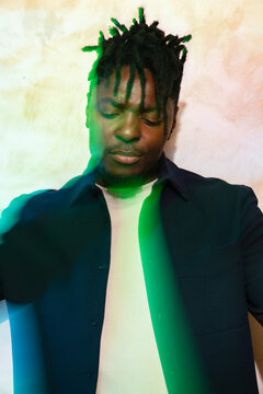 Calm man under vibrant green lighting effect
