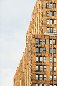 Geometric Brick Building Facade Against a Clear Blue Sky in the 