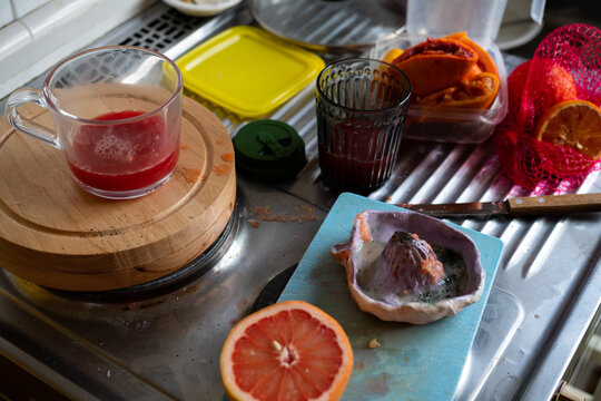A kitchen desk with self pressed blood oranges 