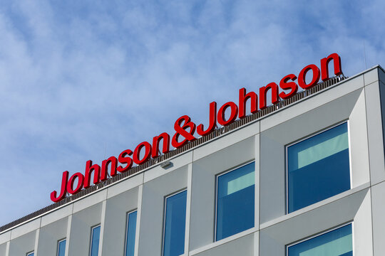 Exterior shot of the Johnson & Johnson corporate building, showcasing its modern architecture and prominent branding against a clear sky. Leiden, Netherlands, 3 May 2025.