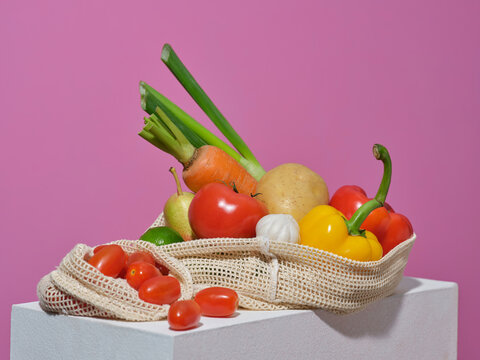 A collection of fresh vegetables, including tomatoes, carrots