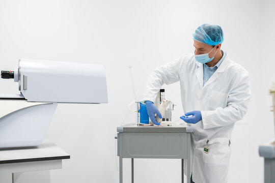 Researcher Handling Rat In Ethical Animal Research Lab