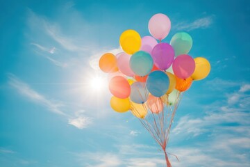 Colorful Balloons Floating Freely Against the Vast Expanse of the Bright Blue Sky