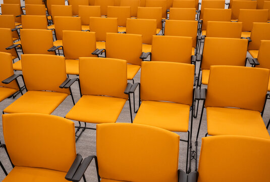 Rows Of Empty Minimalist Design Chairs Indoors