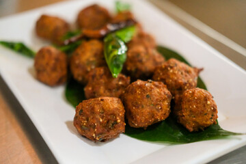 Lab Moo Tod or Crispy Larb Moo, Meatball of chopped pork mix with Thai spicy curry. Served on plate.