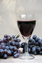 glass of wine and grapes on the table