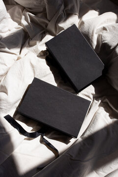 Black gift boxes on soft fabric