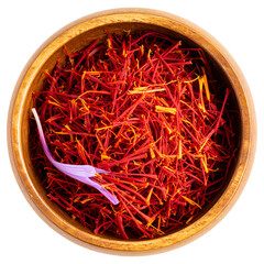 Fototapeta premium Vibrant red chili peppers and golden saffron threads sit in a bowl, a dry, hot, and spicy cooking ingredient