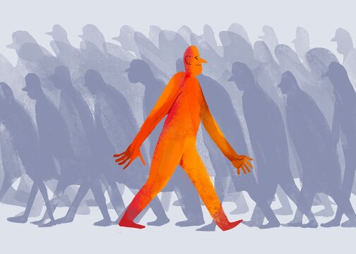 a man moves against the flow of the crowd
