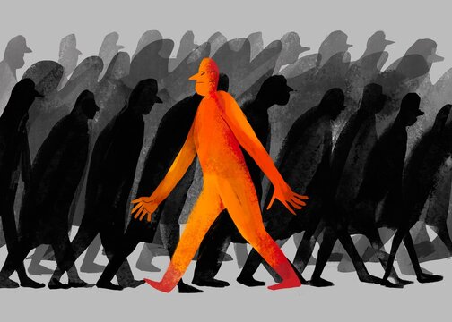 a man moves against the flow of the crowd
