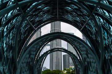Steel architecture bridge framing Petronas Towers view