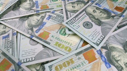 Various Bundles of US Dollar Bills Positioned in a Chaotic and Disordered Arrangement