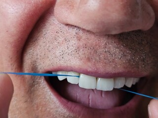Oral care routine with dental floss for maintaining healthy teeth and gums