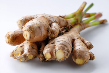 Fresh root ginger on white background