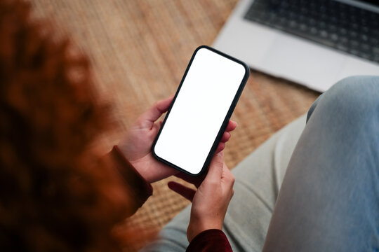 Woman using smartphone with white screen
