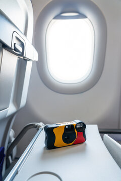 Disposable camera on airplane tray