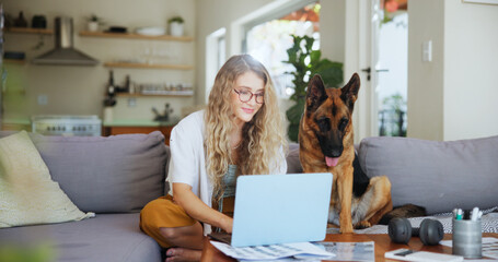 Laptop, typing and dog with woman on sofa for pet insurance research, premium benefits and planner....