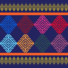 A pattern featuring a series of colorful diamond-shaped motifs arranged in rows against a dark blue background.