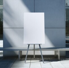 Blank white presentation board on gray easel outdoors