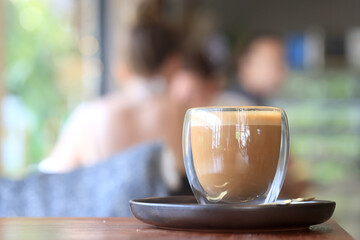 cappuccino, coffee in a clear glass cup in a cafe, soft color background food and drink, hot drink