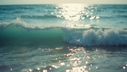 Breaking ocean wave with white caps on sunny day