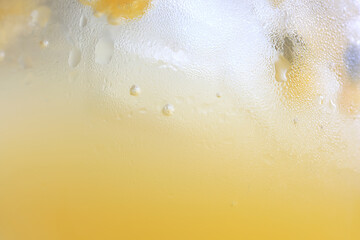 passion fruit lemonade background, cold lemonade in a glass, delicate texture cold tropical drink...