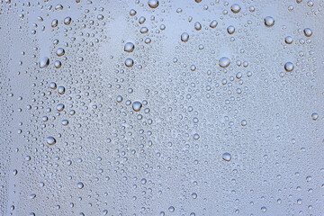 drops glass blue background abstract, transparent cold background water splashes