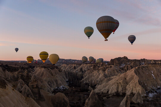 Fototapeta Hot air balloons rising at dawn